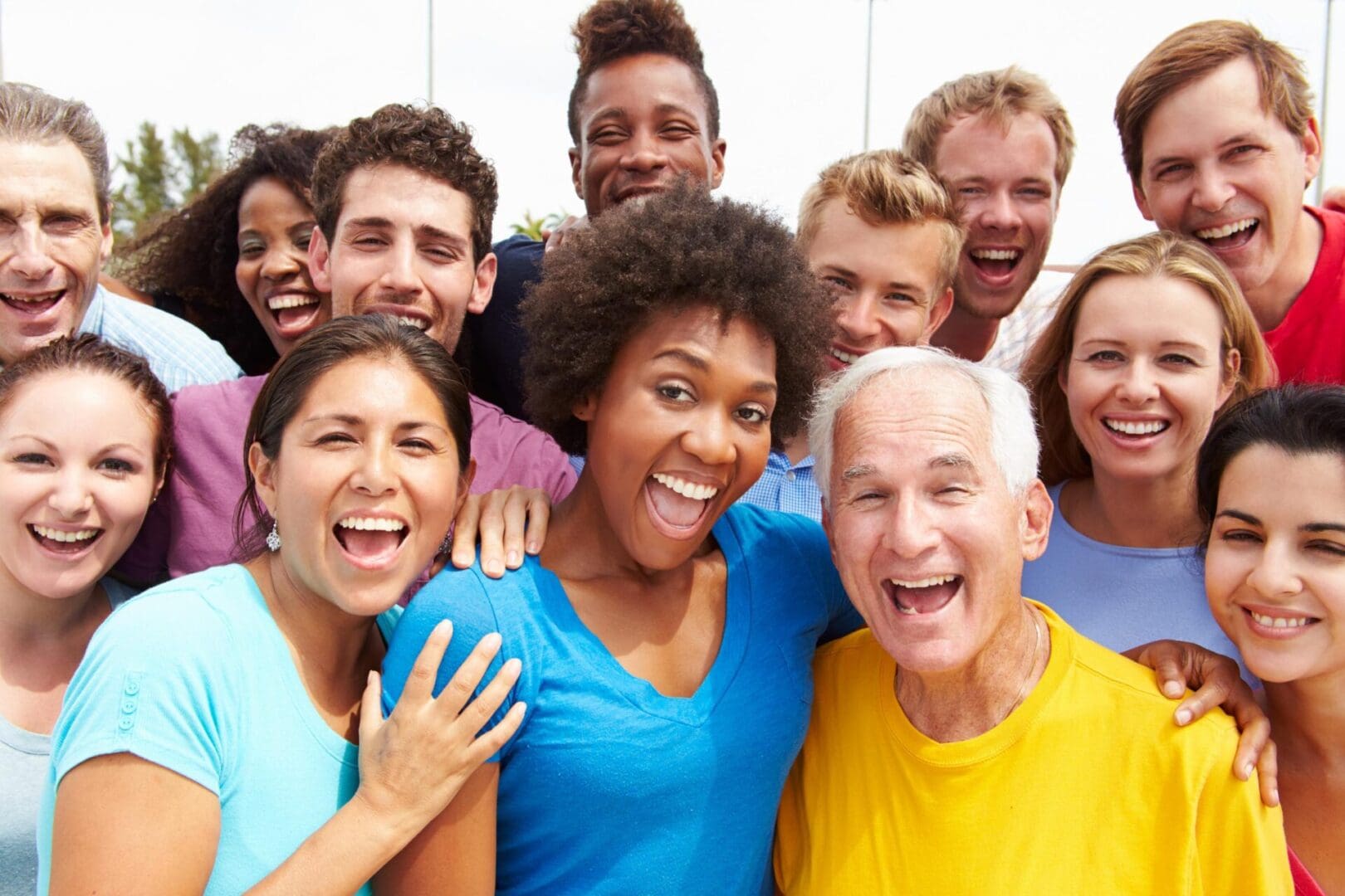 Group of diverse people smiling and laughing.