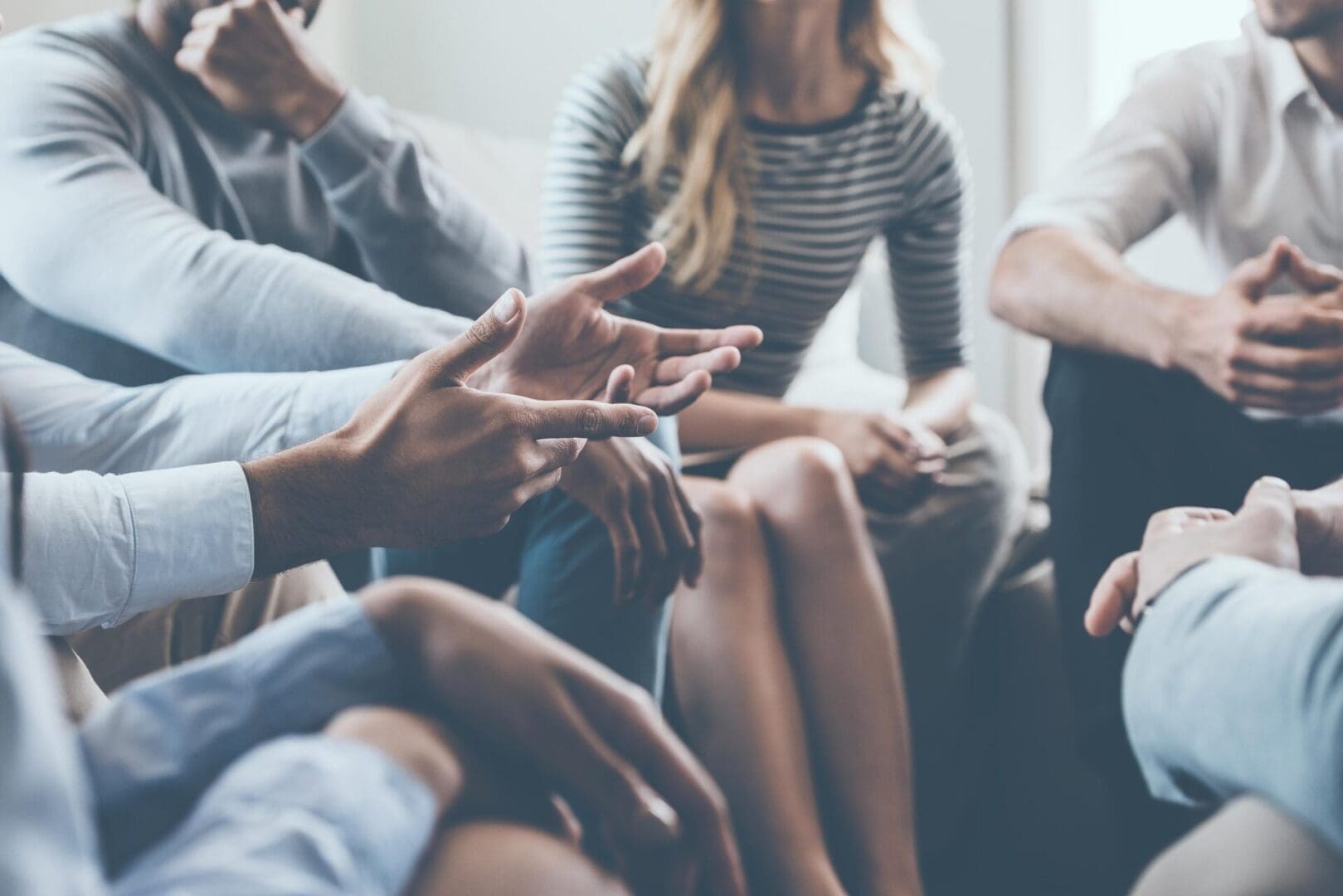 Close-up of hands during group discussion.