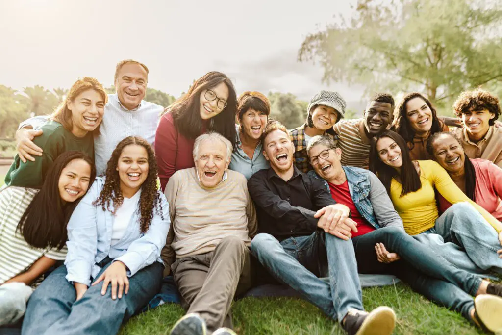 Diverse group of people laughing together.