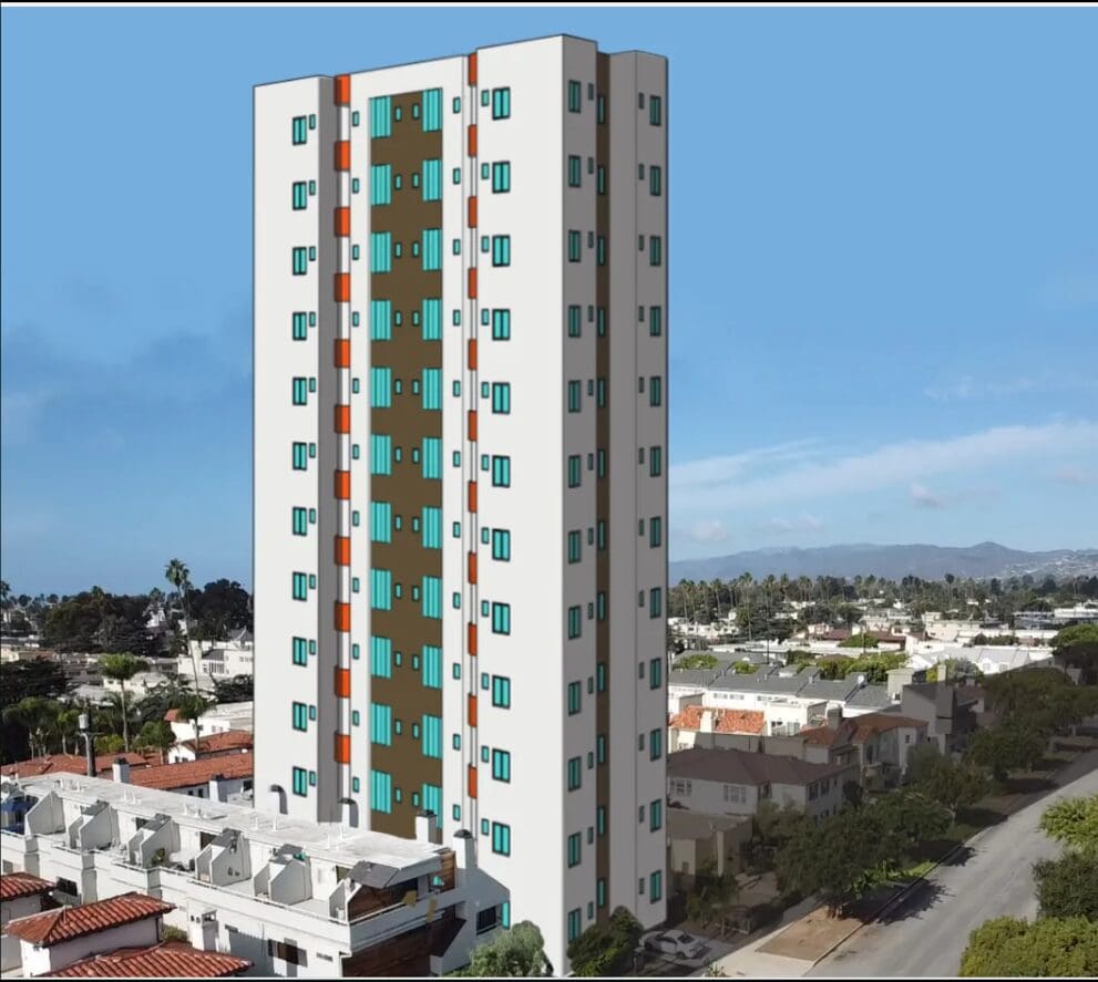 Tall apartment building with blue windows.