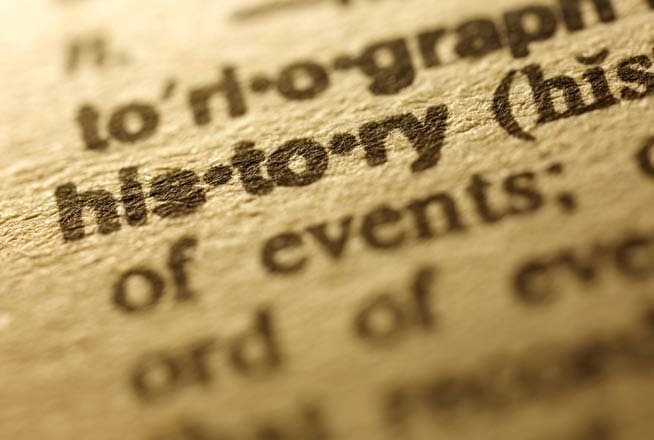 Close-up of the word "history" in a dictionary.